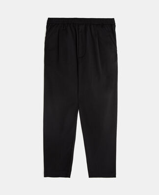 Carrot silhouette pleated trousers