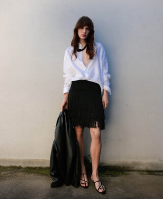 Falda corta punto intarsia flecos