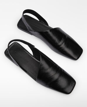 Leather asymmetric mules