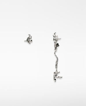 Asymmetrical metal earrings woman