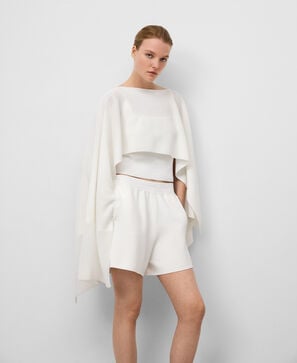 Cape asymétrique en maille femme