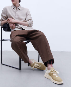 Leather and neoprene sneaker.