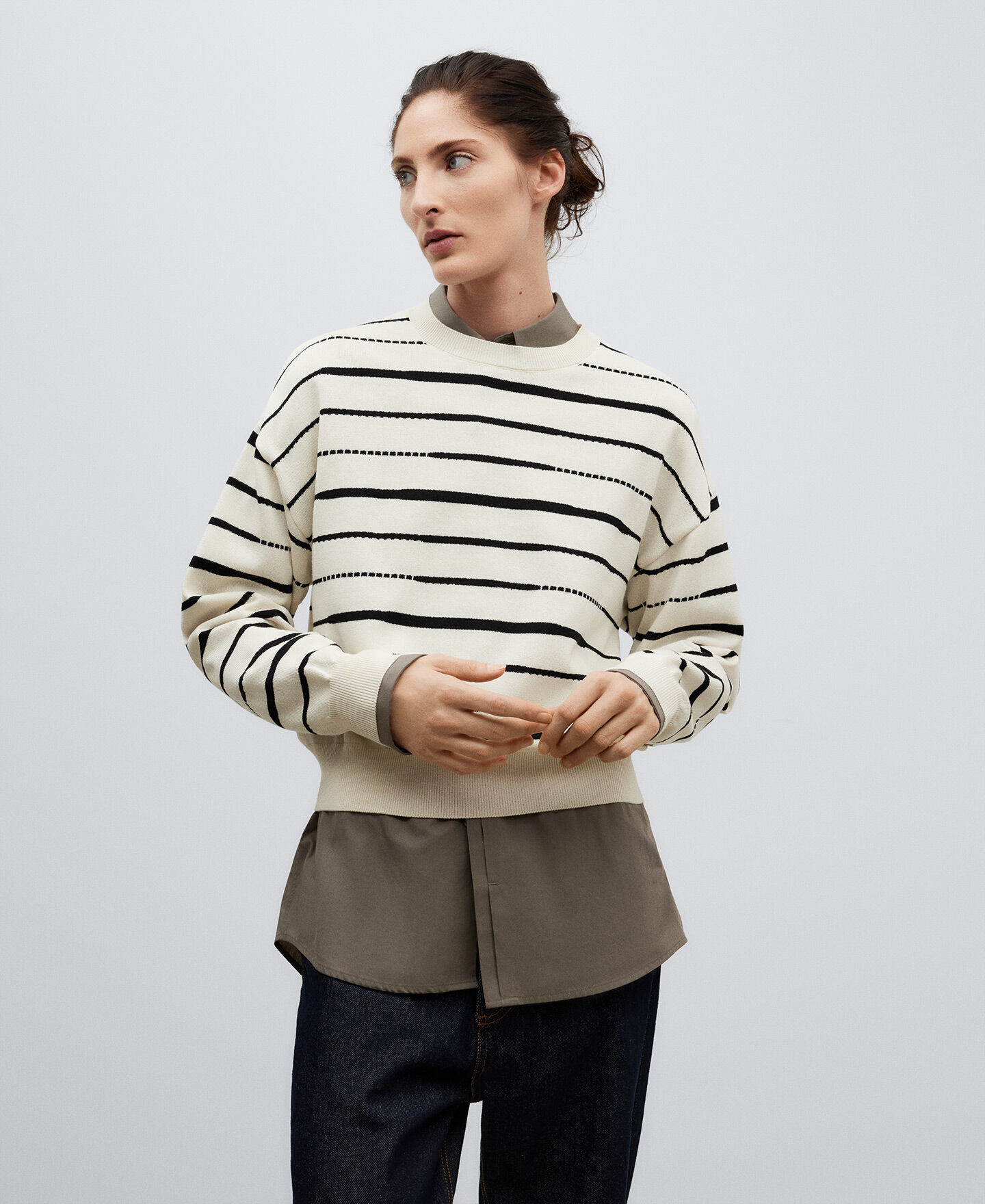 Asymmetrical outlet striped sweater
