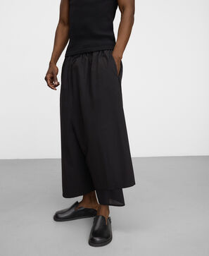 Overlay piece asymmetric bermuda shorts