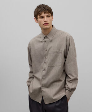 Asymmetrical buttoning shirt man