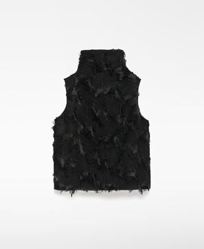 Top semitransparente con flecos