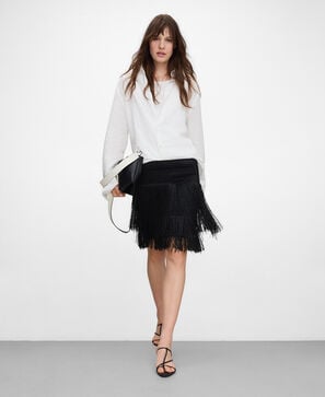 Falda corta punto intarsia flecos