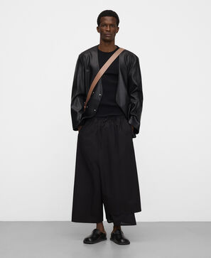 Overlay piece asymmetric bermuda shorts