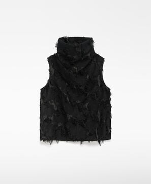 Top semitransparente con flecos