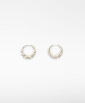 Textured metal hoops woman