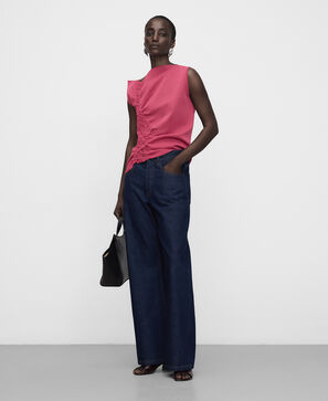 Asymmetric knit top with side ruffle