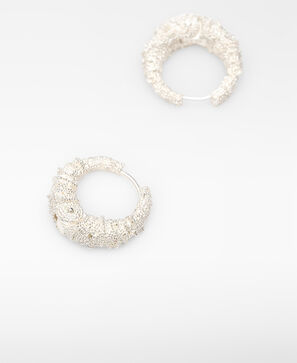 Textured metal hoops woman