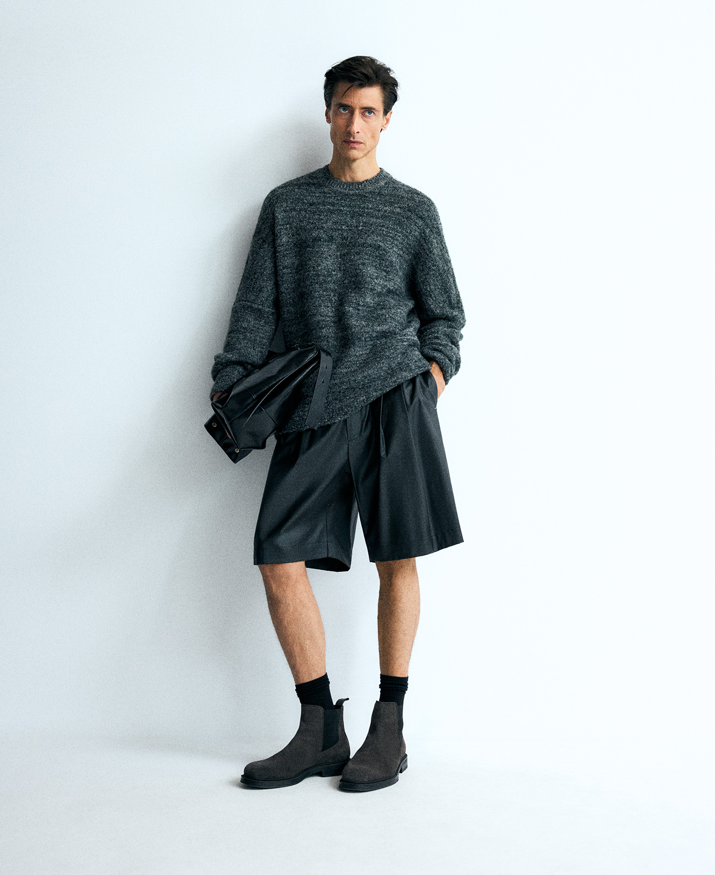 Relaxed fit black Bermuda shorts man image number 1