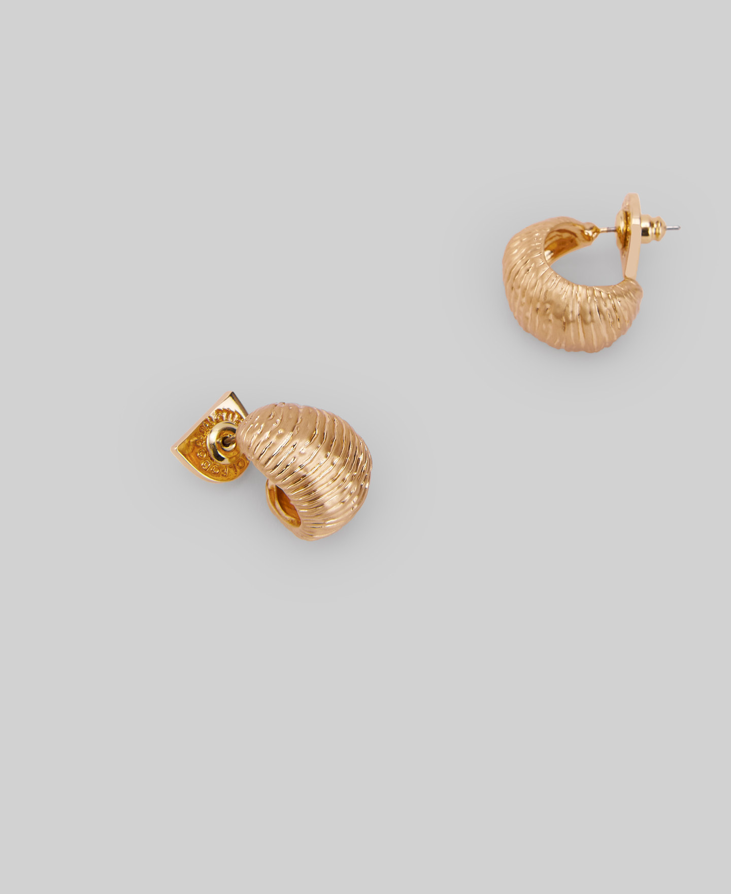 Golden hoops with a shell relief woman image number 1