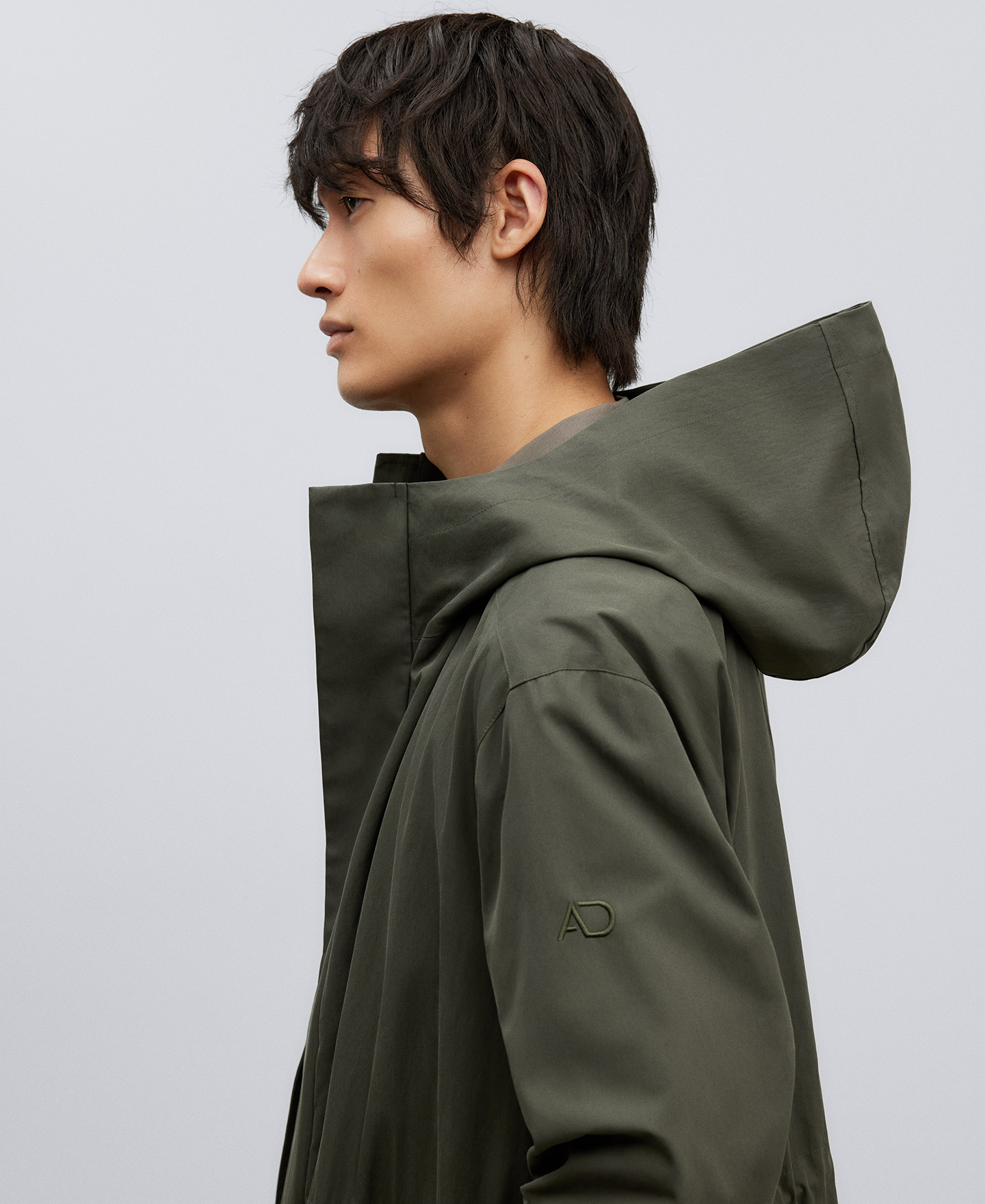 Green hooded trench man image number 3