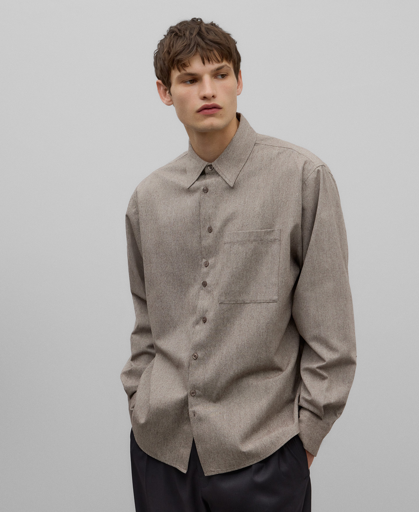 Asymmetrical buttoning shirt man image number 0