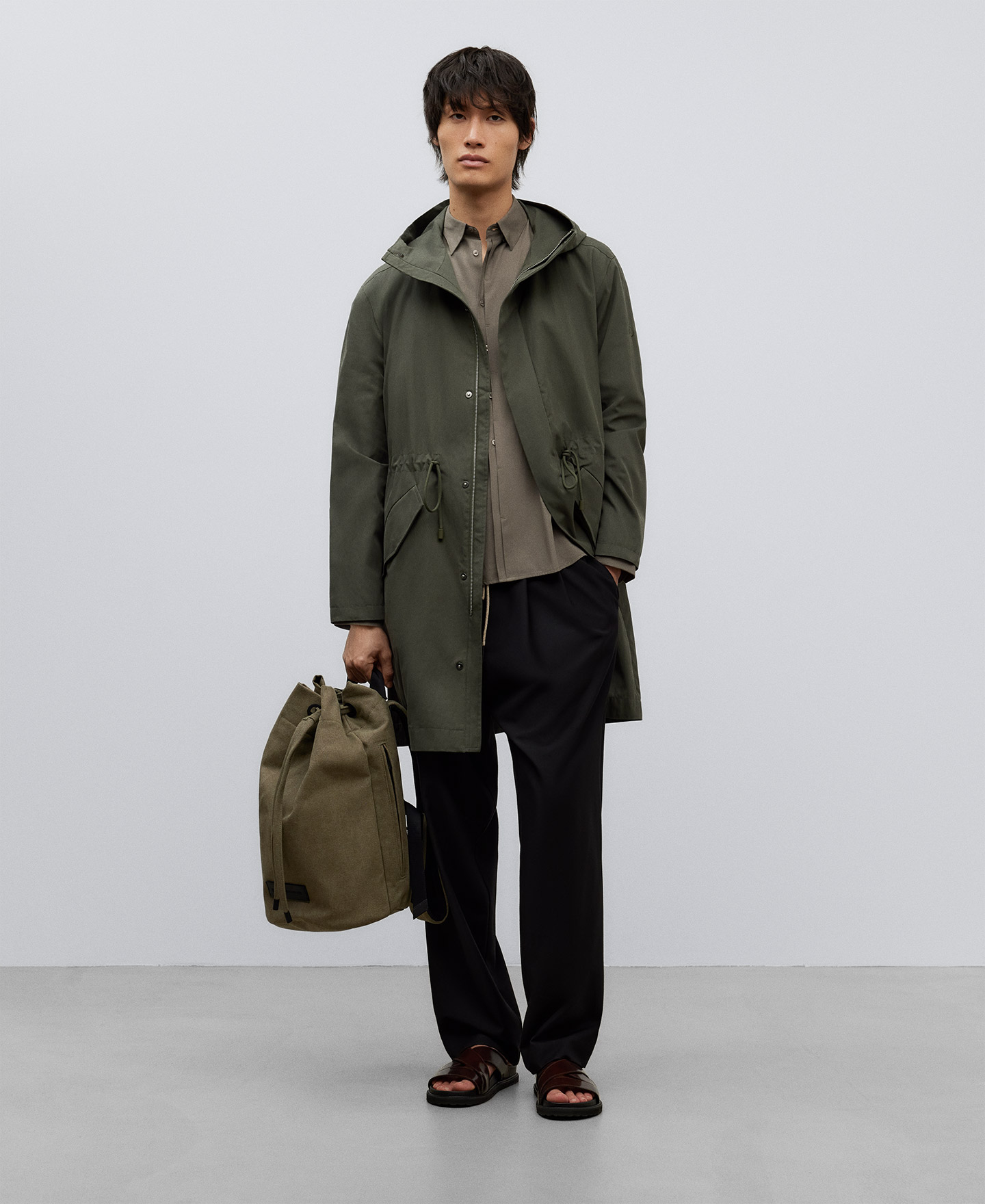 Green hooded trench man image number 1