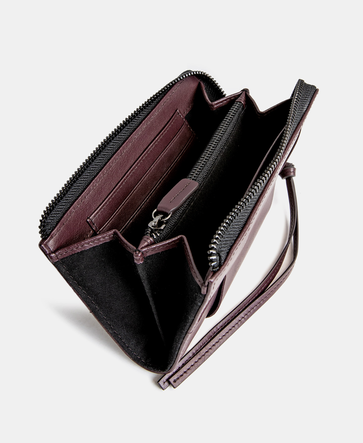Cartera trenzada en piel vaqueta image number 1