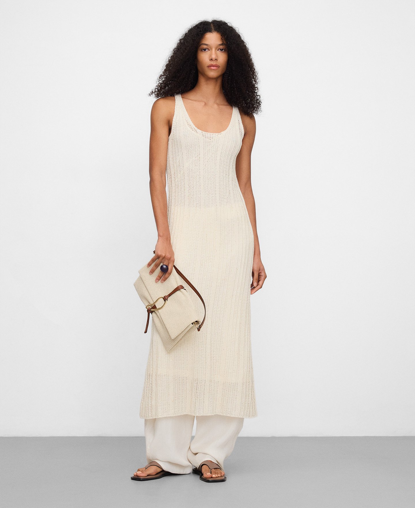 Raffia texture clutch with metal piece image number 4