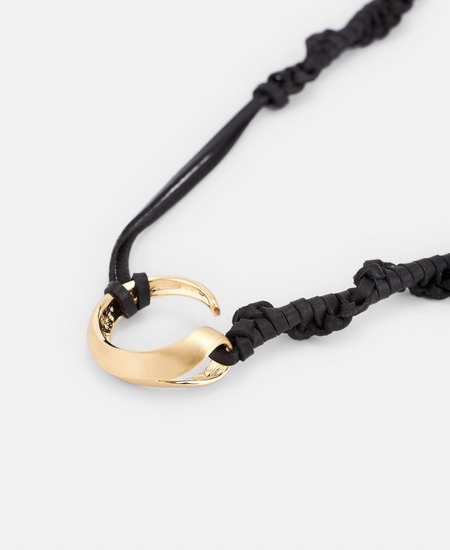 Metal pendant with braided leather image number 1