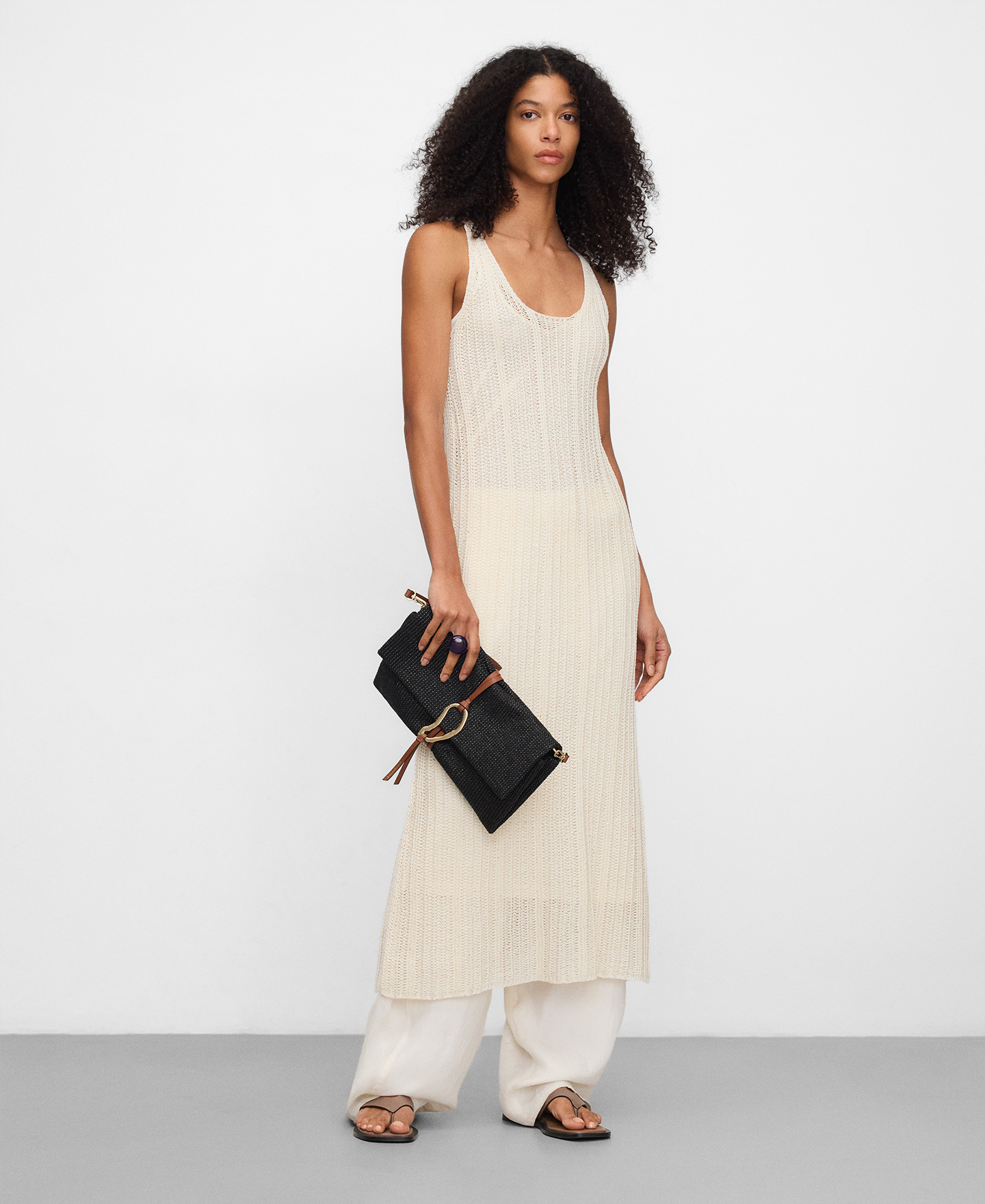 Raffia texture clutch with metal piece image number 4