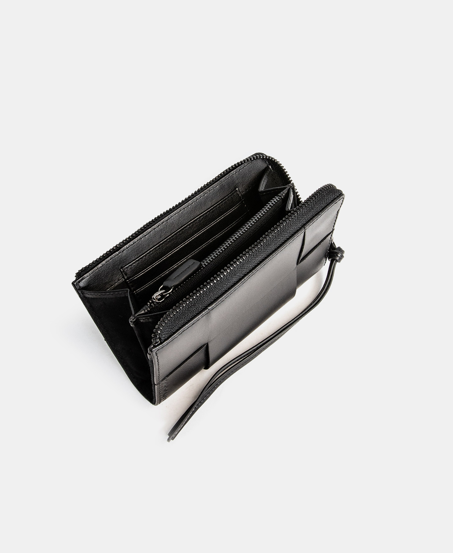 Cartera trenzada en piel vaqueta image number 2