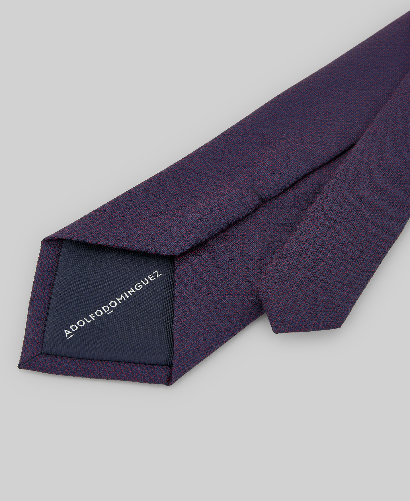 Navy blue and red tie man image number 1