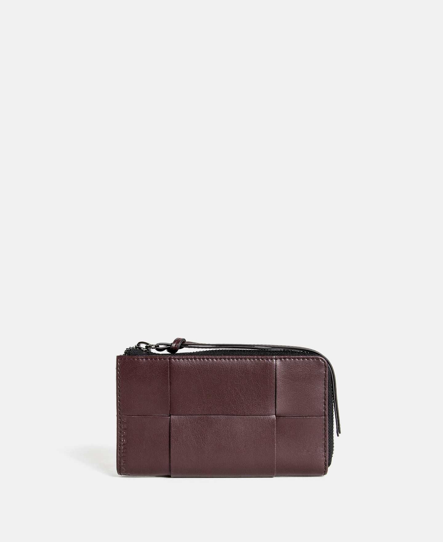 Cartera trenzada en piel vaqueta image number 0
