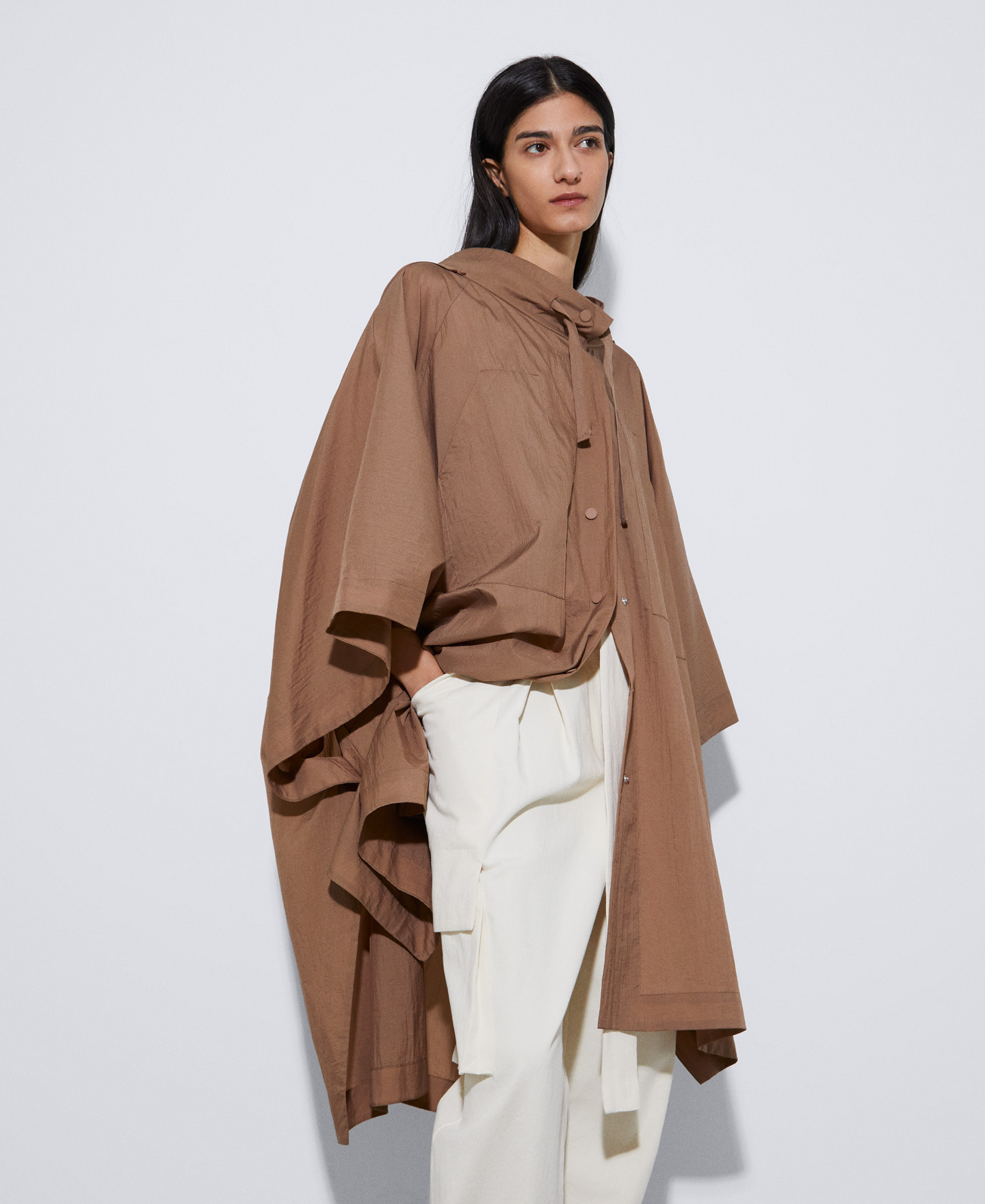 Nylon cape transformable into a skirt image number 0