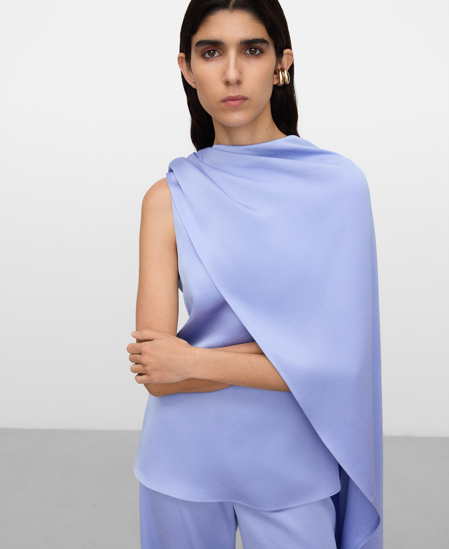 Peplum top with asymmetric overlaid cape image number 0