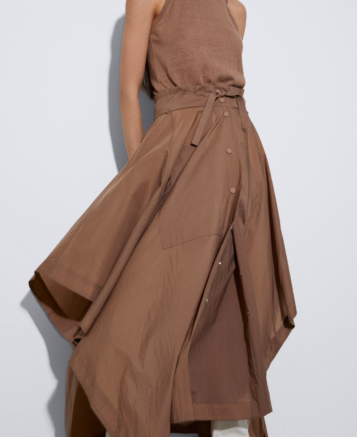 Nylon cape transformable into a skirt image number 3