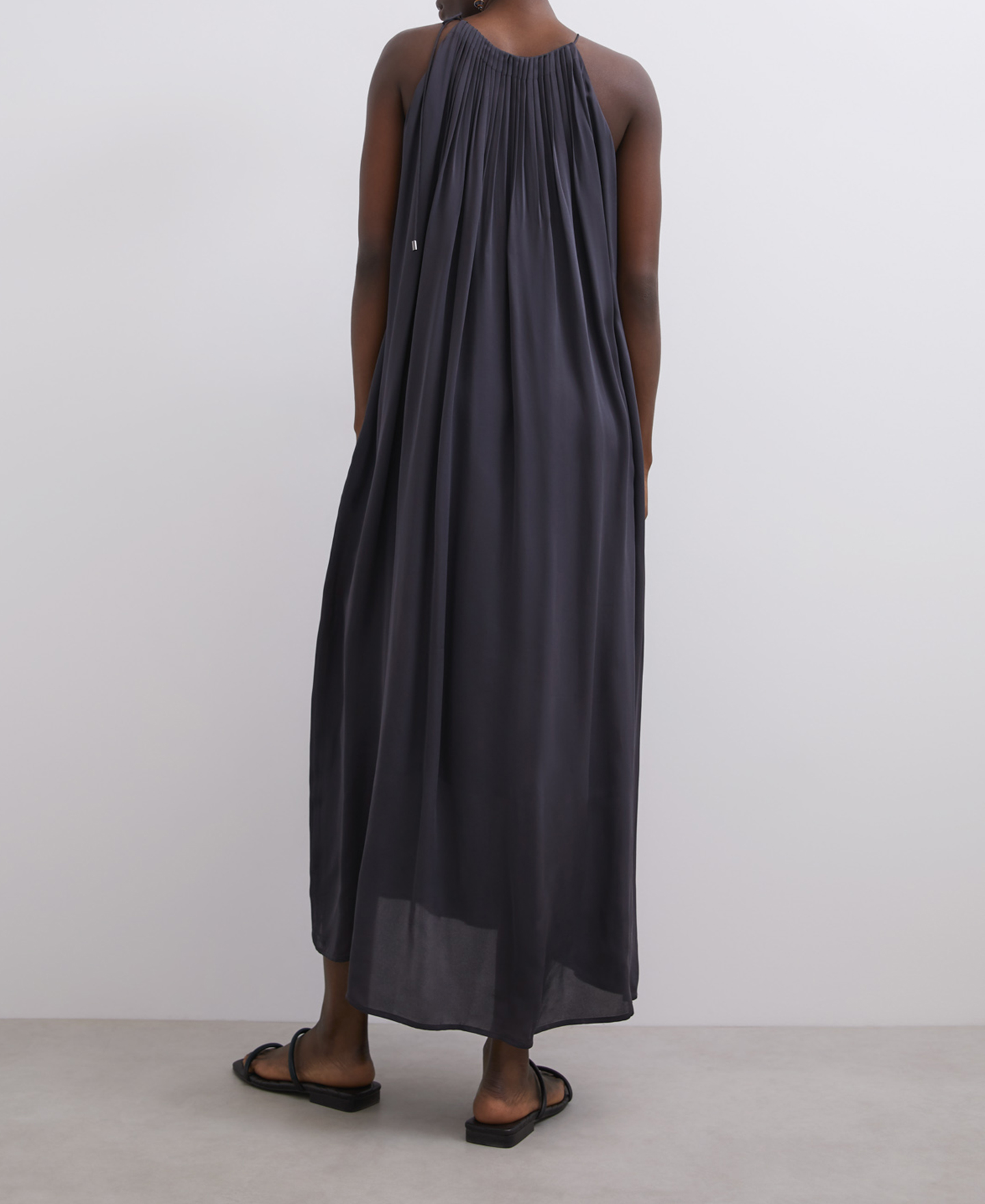 Long pleated dress with halter neckline image number 1